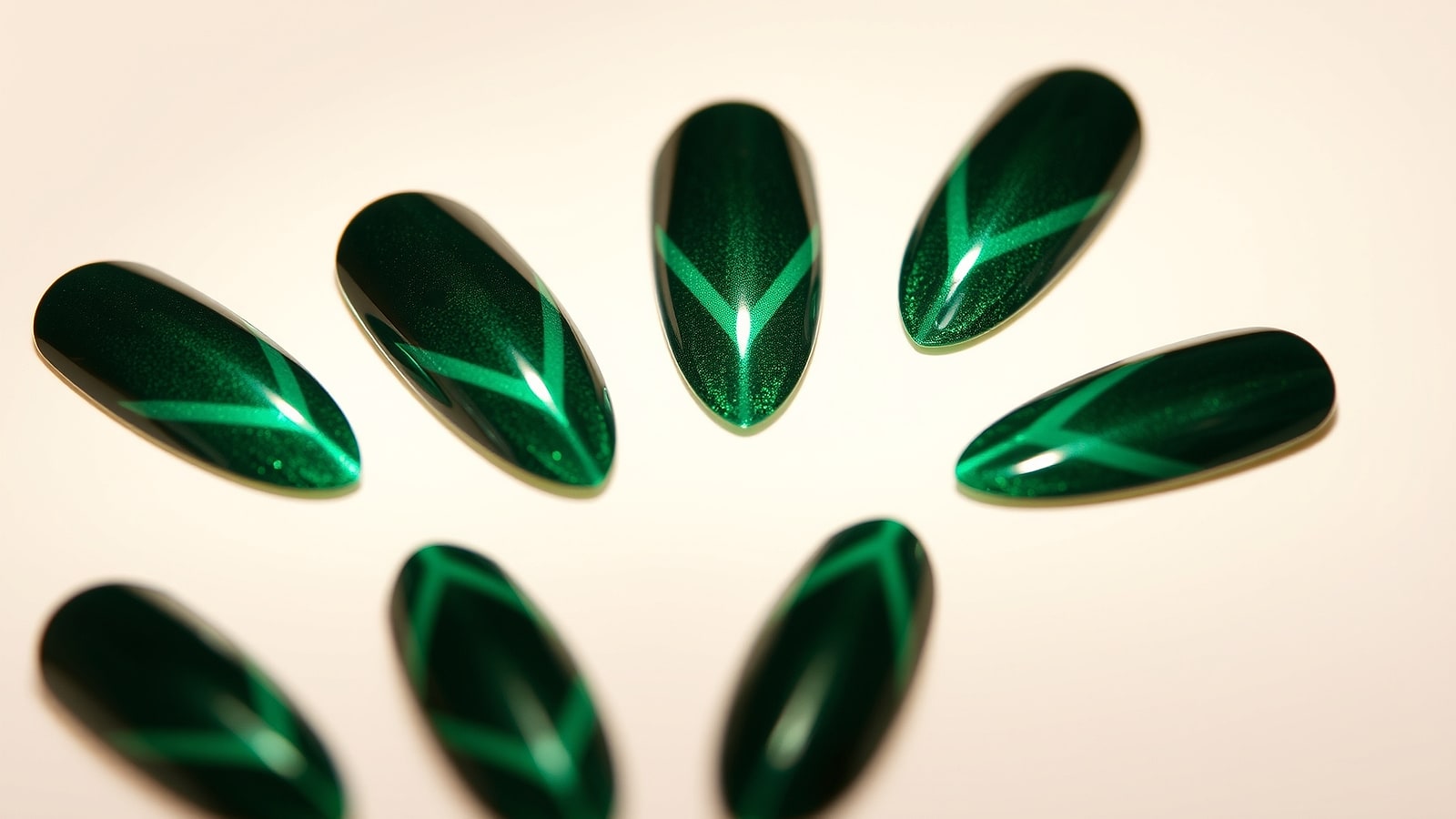 Macro of magnetic cat-eye nails, a band of light sweeping across each nail