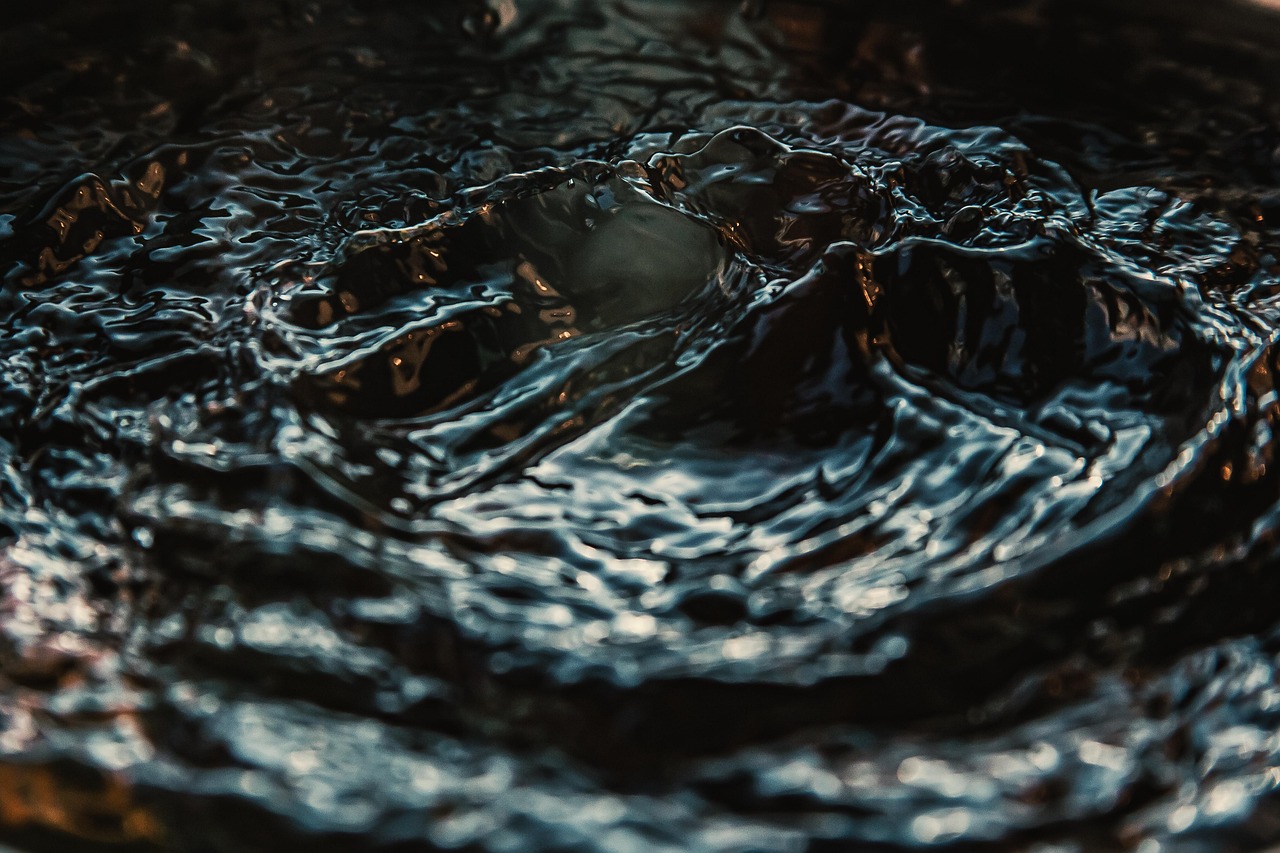 Dark rippling water catching low light